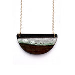 Brevity one-of-a-kind ceramic pendant necklace, half-moon glazed in white and bronze, on a fine chain